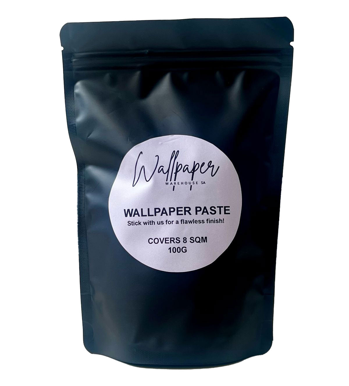 A black pouch of wallpaper paste with a label that reads 'Wallpaper Paste Covers 8 sqm 100g'.