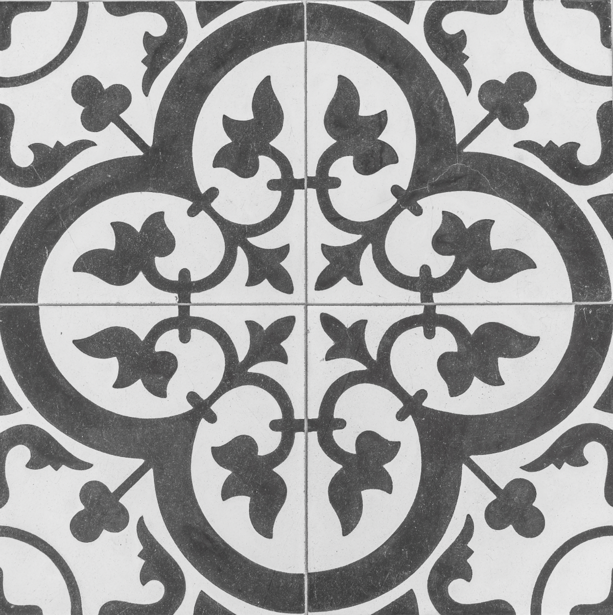 Decorative tile with intricate black and white pattern