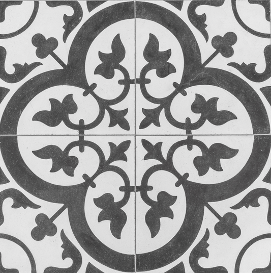 Decorative tile with intricate black and white pattern
