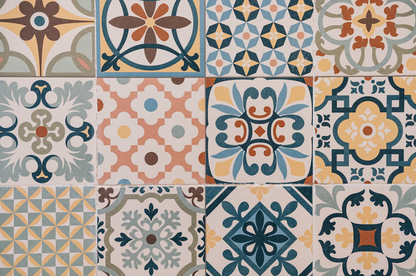 Patterned tiles with various geometric and floral designs in a grid layout.