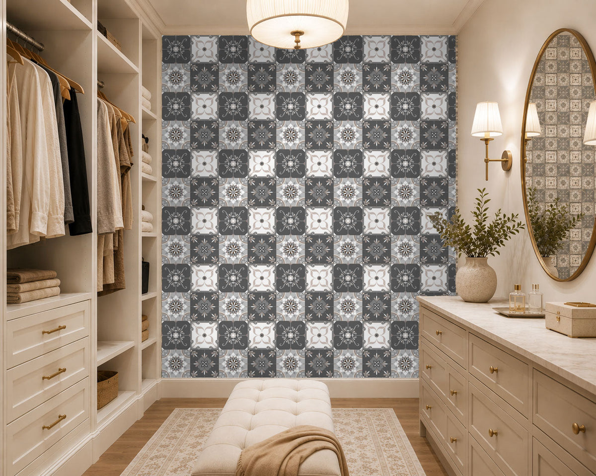 Modern walk-in closet with patterned wallpaper, dressers, and a mirror.