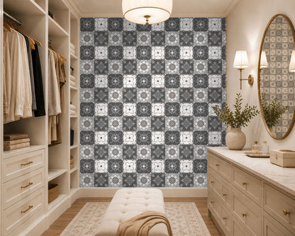 Modern walk-in closet with patterned wallpaper, dressers, and a mirror.