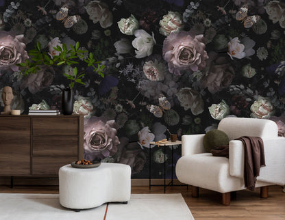 A vibrant wall mural featuring a dense floral pattern with various shades of purple, green, and white, installed in a living room setting.
