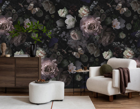 A vibrant wall mural featuring a dense floral pattern with various shades of purple, green, and white, installed in a living room setting.