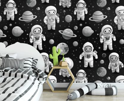 Children's room with space-themed decor including astronauts and planets on the wall.