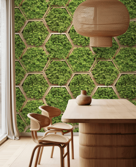 Dining area with wooden table and chairs against a green hexagonal patterned wall.