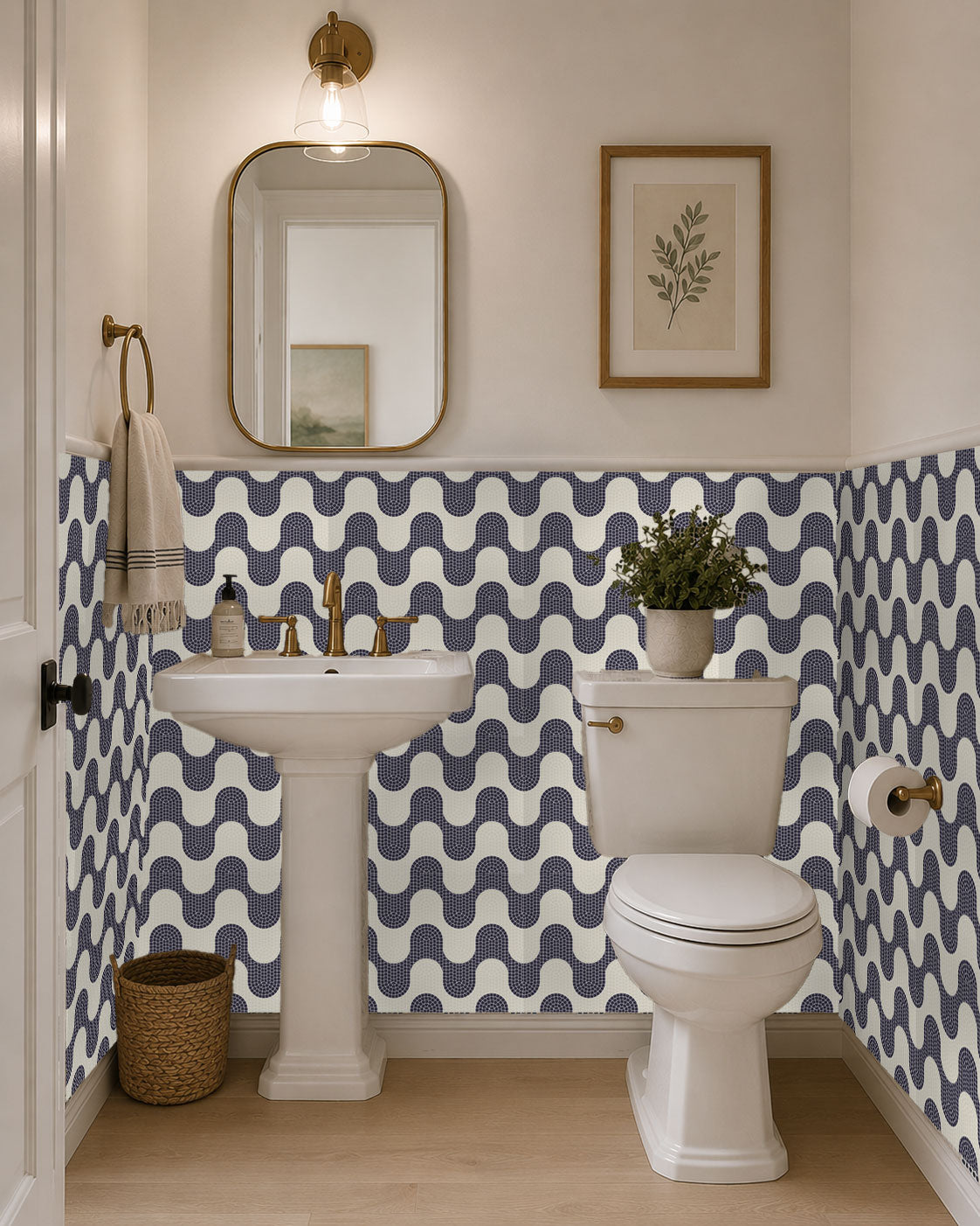 Bathroom with wavy blue and white wallpaper, sink, mirror, and toilet.