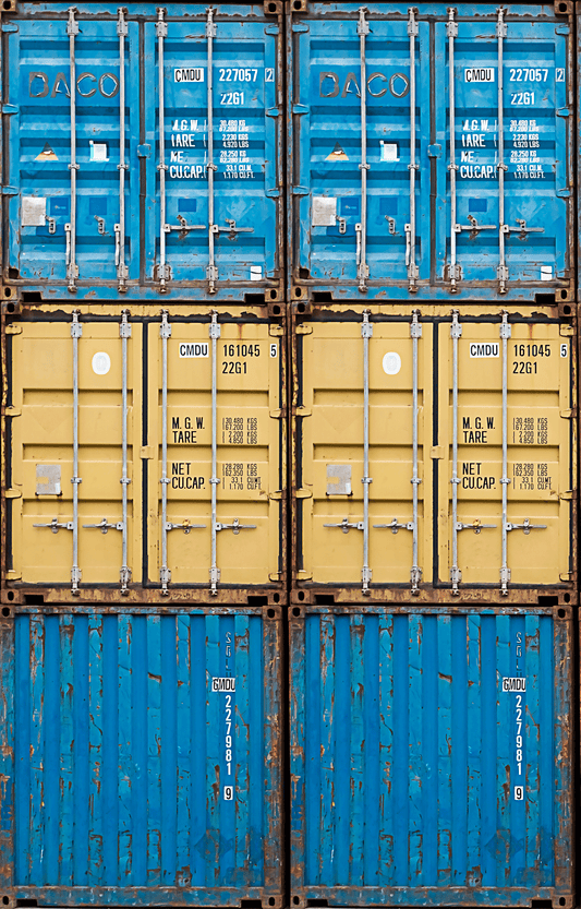 Stack of blue and yellow shipping containers with visible labels.