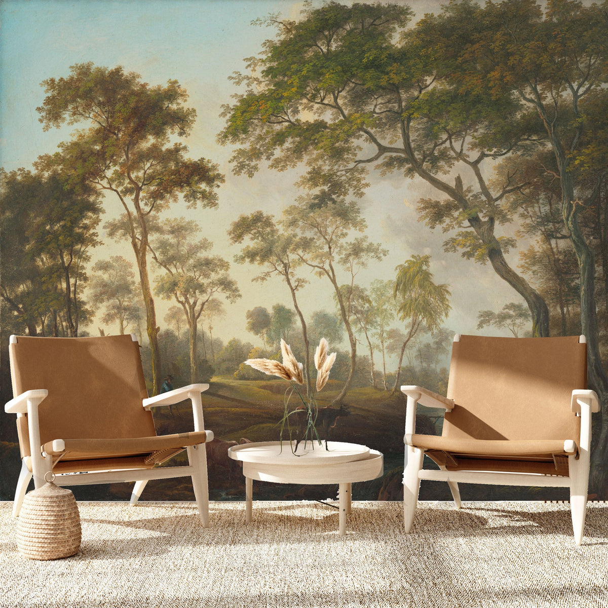 A mural depicting a lush outdoor scene with trees and a hazy sky, complementing two armchairs and a round coffee table in a interior setting.