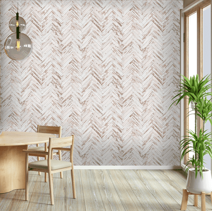 Dining room with wooden table and chairs against a wall with chevron patterned wallpaper.