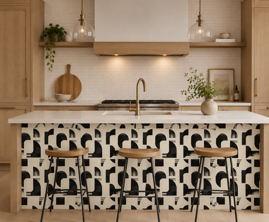 Modern kitchen with geometric patterned backsplash, wooden stools, and white countertops.