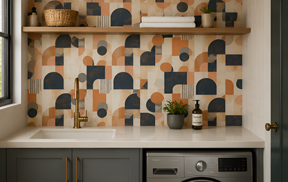 Modern kitchen with geometric patterned backsplash, sink, and appliances.