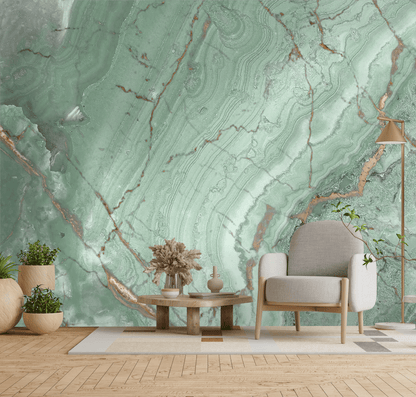 Living room with a green marble wall, gray armchair, and wooden coffee table.